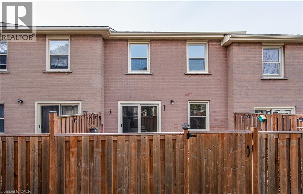 Back of house featuring brick siding - 27 Queenston Drive, Kitchener, ON - Outdoor With Exterior