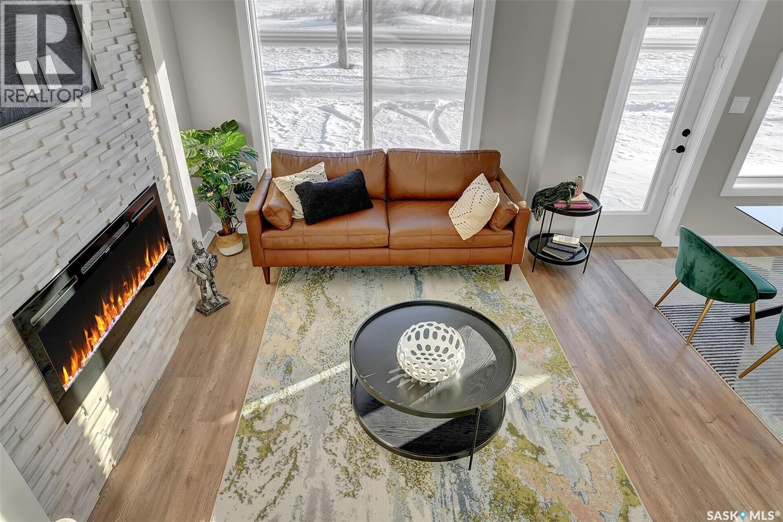 230 Kostiuk Crescent, Saskatoon, SK - Indoor Photo Showing Living Room With Fireplace