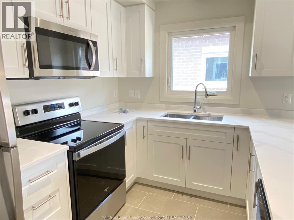 233 Watson Unit# 305, Windsor, ON - Indoor Photo Showing Kitchen With Double Sink