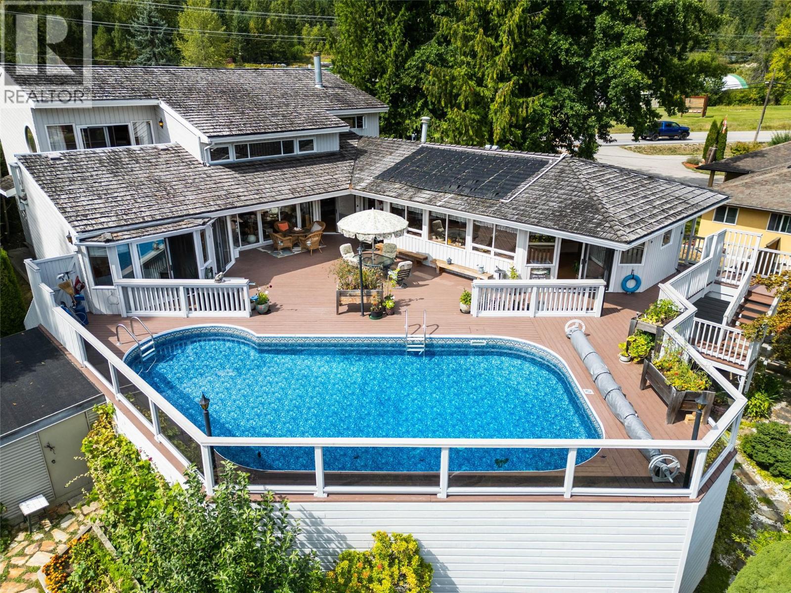 1896 3A Highway, Nelson, BC - Outdoor With Above Ground Pool With Deck Patio Veranda With Exterior