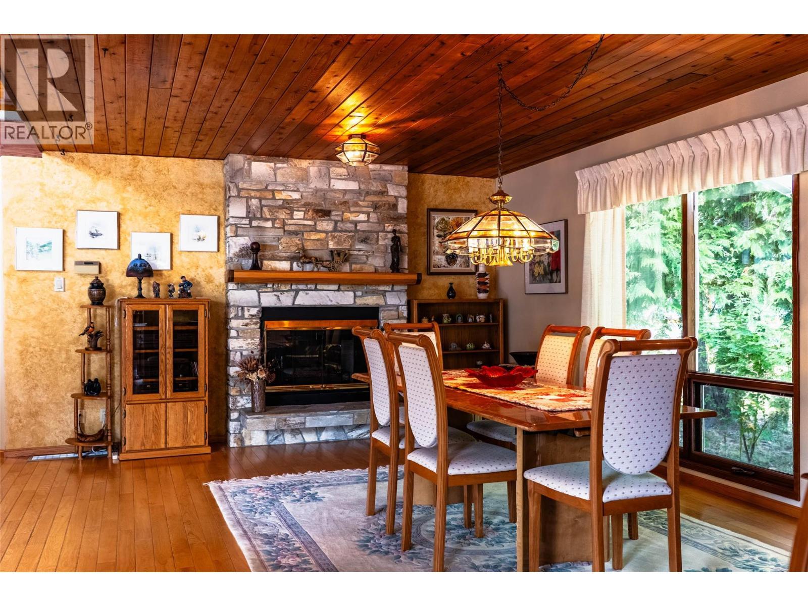 1896 3A Highway, Nelson, BC - Indoor Photo Showing Dining Room With Fireplace