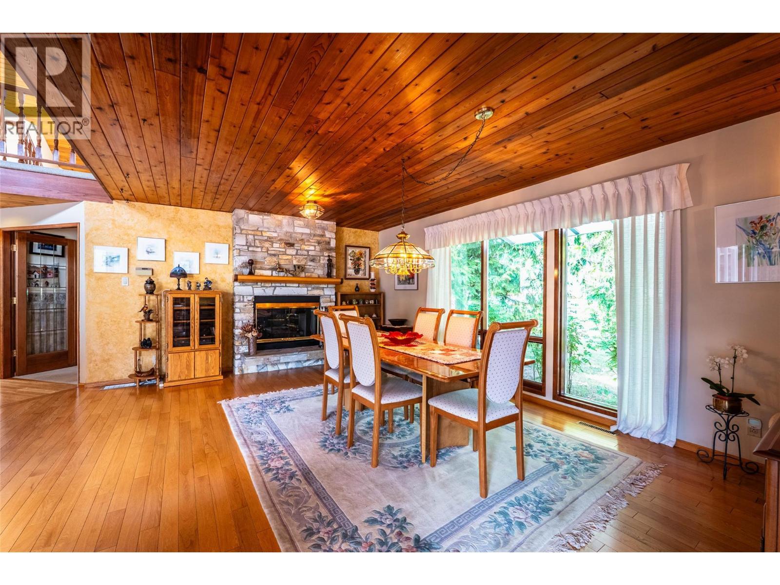 1896 3A Highway, Nelson, BC - Indoor Photo Showing Dining Room With Fireplace