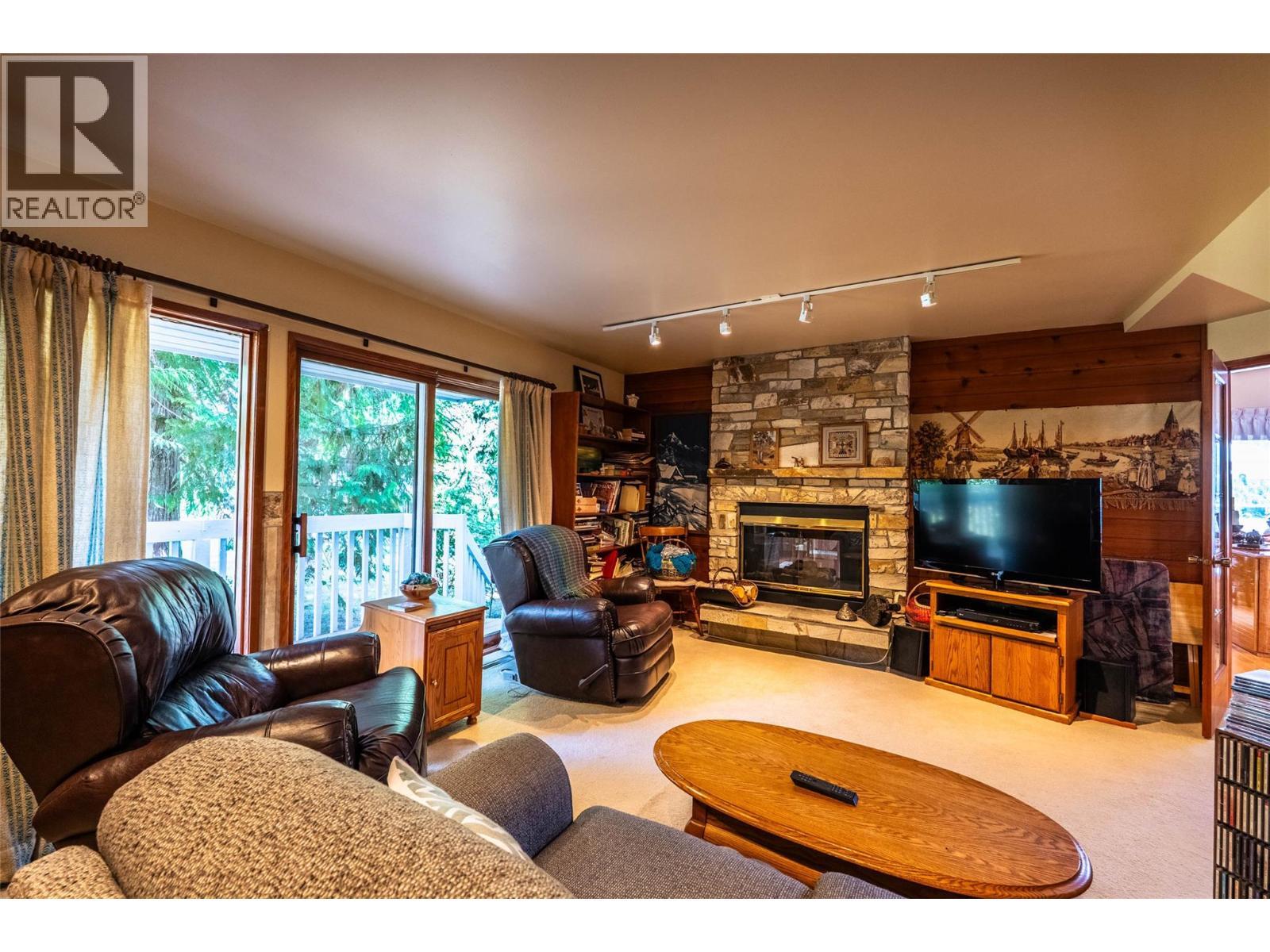1896 3A Highway, Nelson, BC - Indoor Photo Showing Living Room With Fireplace