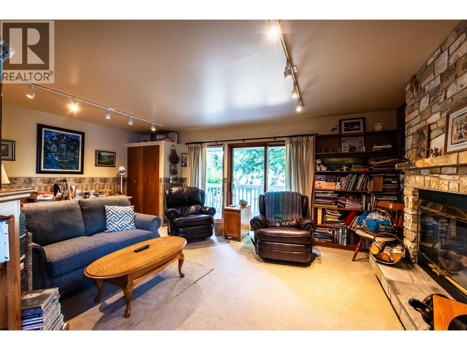 1896 3A Highway, Nelson, BC - Indoor Photo Showing Living Room With Fireplace