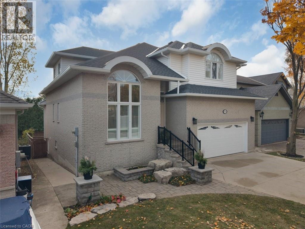 View of front of home featuring driveway, a garage, brick siding, and roof with shingles - 90 Westlawn Drive, Hamilton, ON - Outdoor