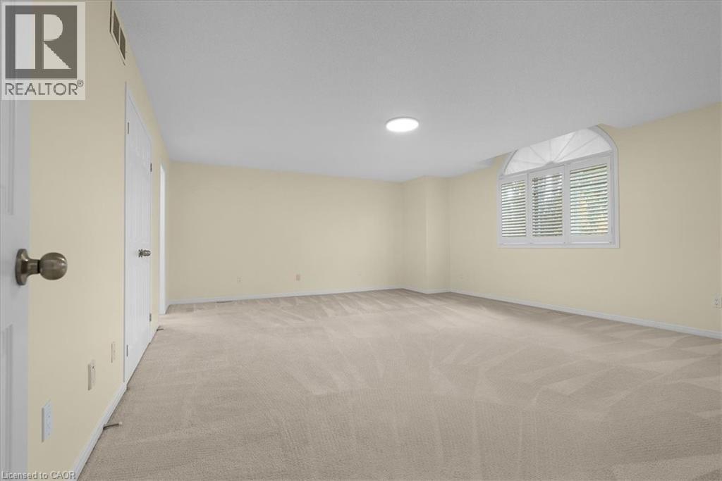 Empty room with light colored carpet and baseboards - 90 Westlawn Drive, Hamilton, ON - Indoor Photo Showing Other Room