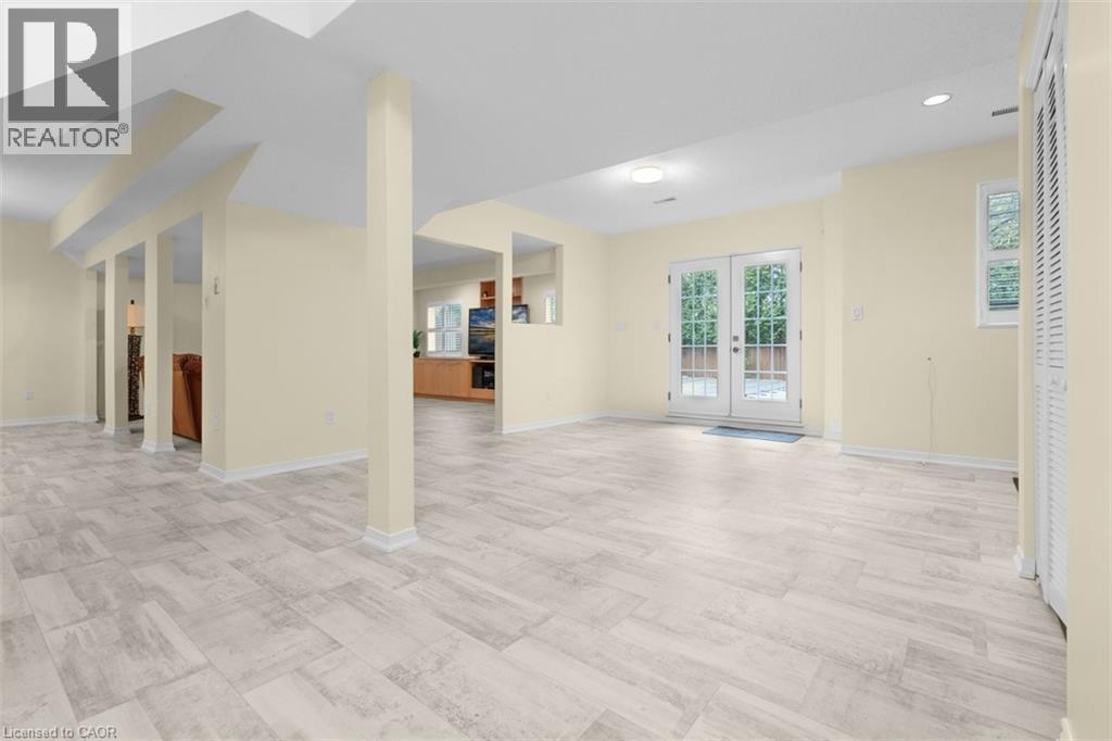 Unfurnished living room featuring french doors and recessed lighting - 90 Westlawn Drive, Hamilton, ON - Indoor Photo Showing Other Room
