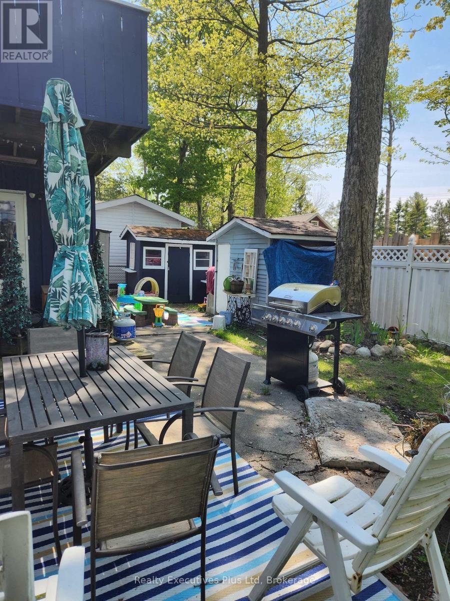 Patio & Rear Yard - 48 Tiny Beaches Road N, Tiny, ON - Outdoor With Deck Patio Veranda