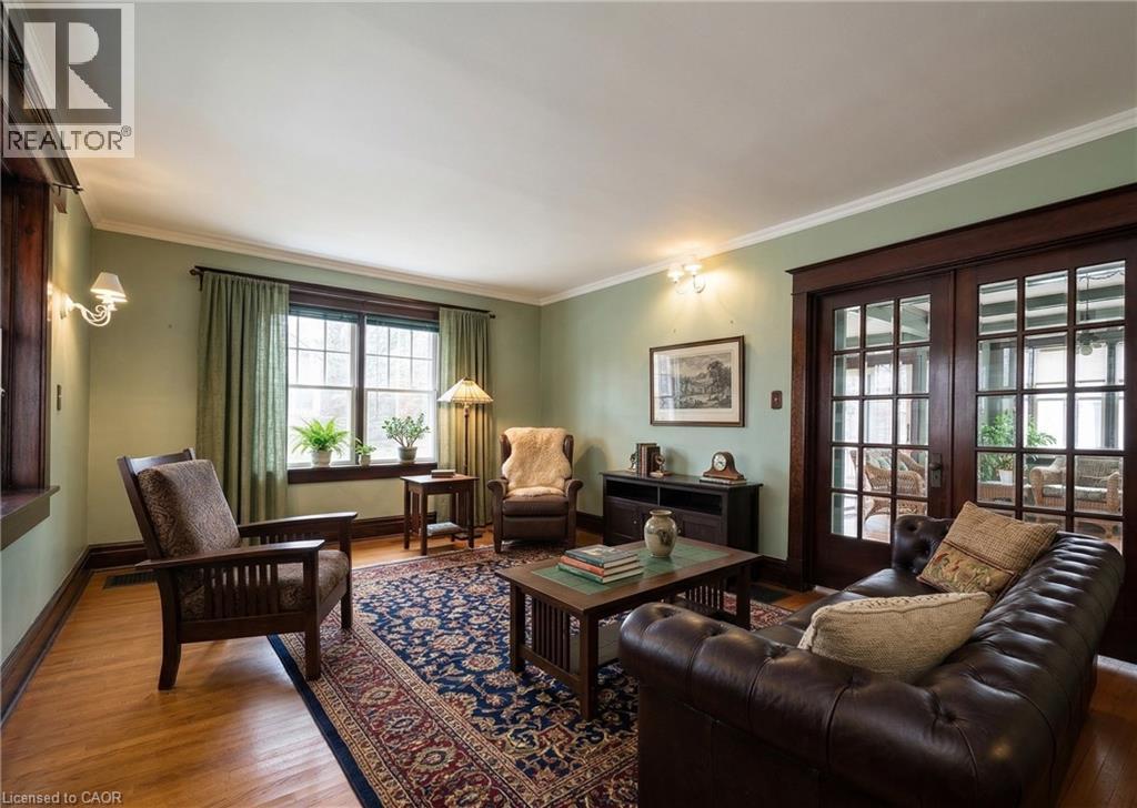 Virtually staged Living room, providing a visual sense of space and proportion - 33 Main Street E, Drayton, ON - Indoor Photo Showing Living Room
