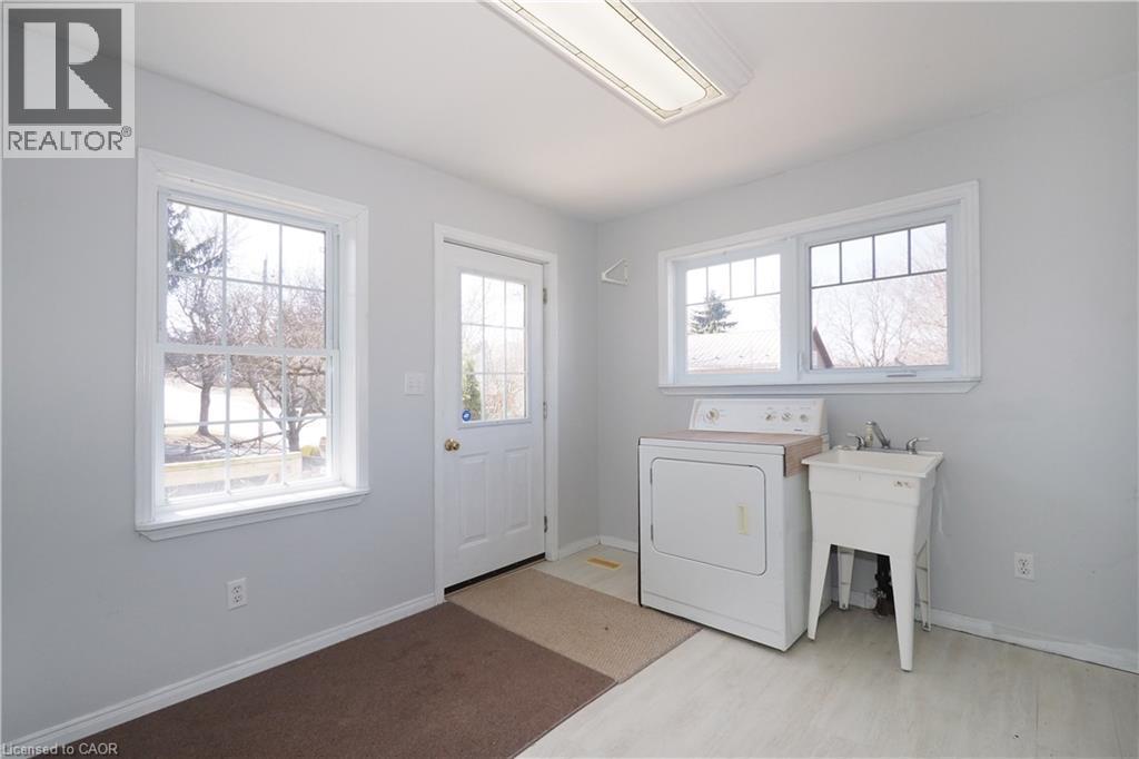 Laundry area featuring a healthy amount of natural light - 33 Main Street E, Drayton, ON - Indoor Photo Showing Laundry Room
