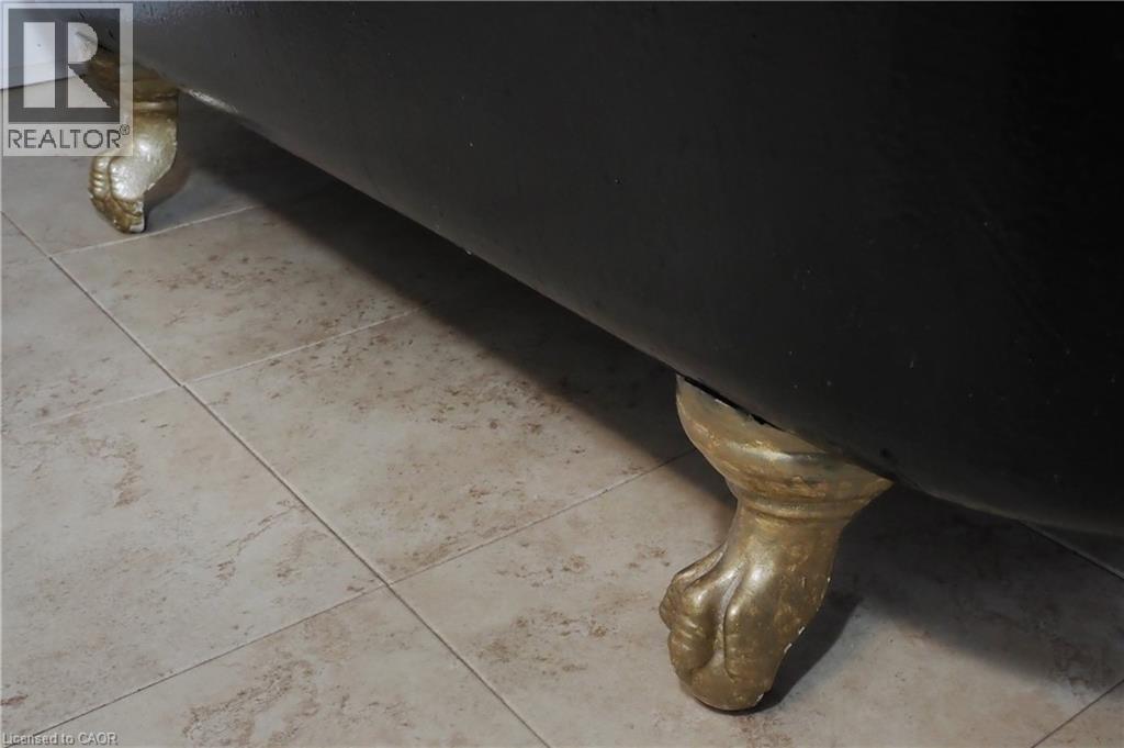 Detailed view of claw foot tub - 33 Main Street E, Drayton, ON -