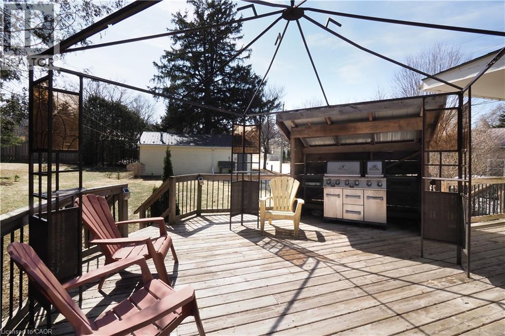 Wooden terrace with a grill - 33 Main Street E, Drayton, ON - Outdoor With Deck Patio Veranda With Exterior