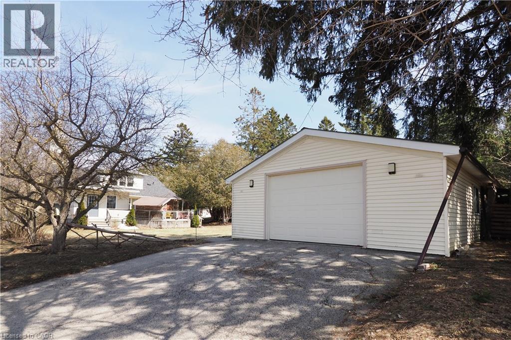 Detached garage featuring asphalt driveway - 33 Main Street E, Drayton, ON - Outdoor
