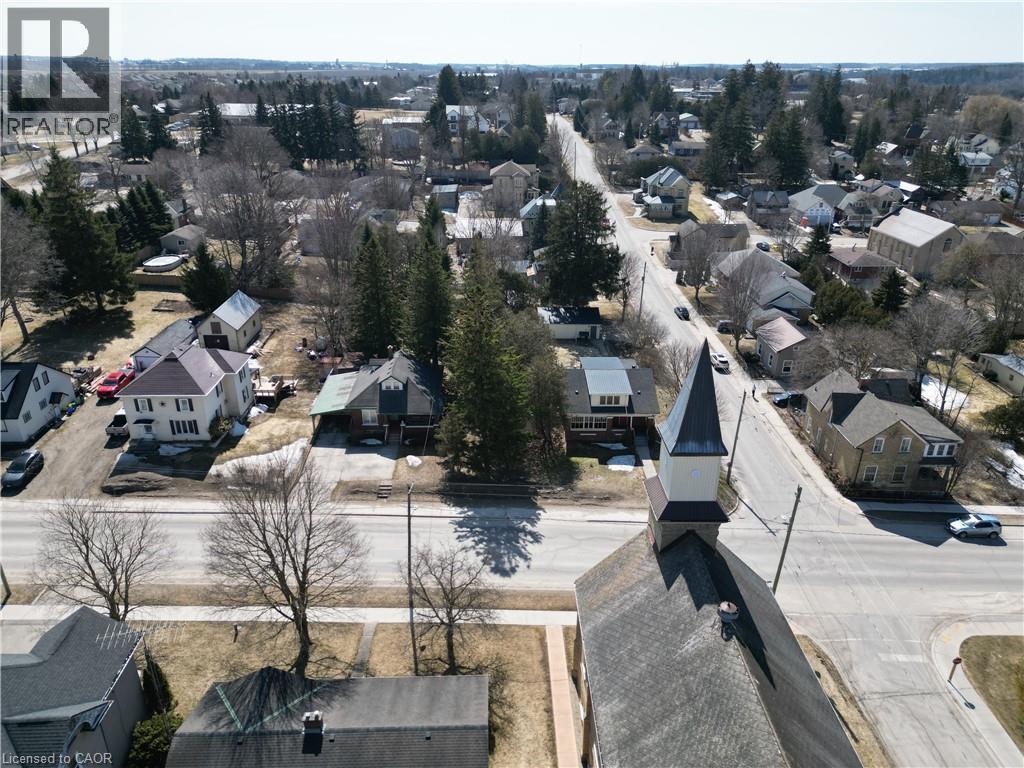 Aerial perspective of suburban area - 33 Main Street E, Drayton, ON - Outdoor With View