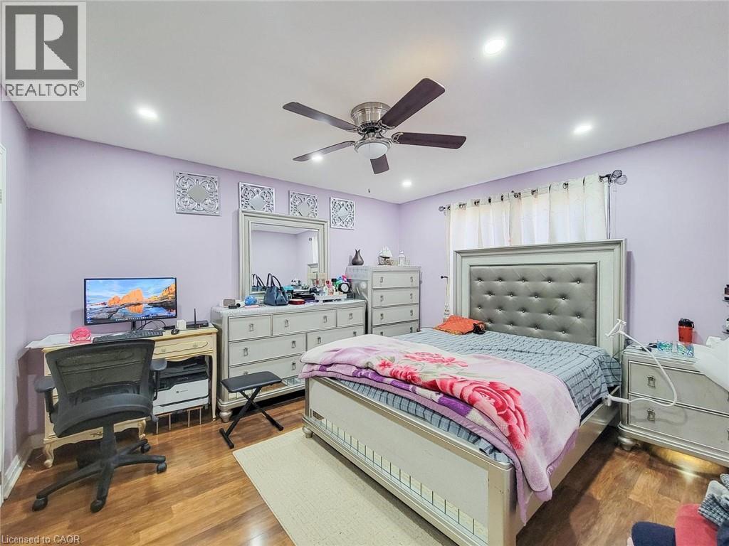 Bedroom featuring wood finished floors, a desk, ceiling fan, and recessed lighting - 823 Queensdale Avenue E, Hamilton, ON - Indoor Photo Showing Bedroom