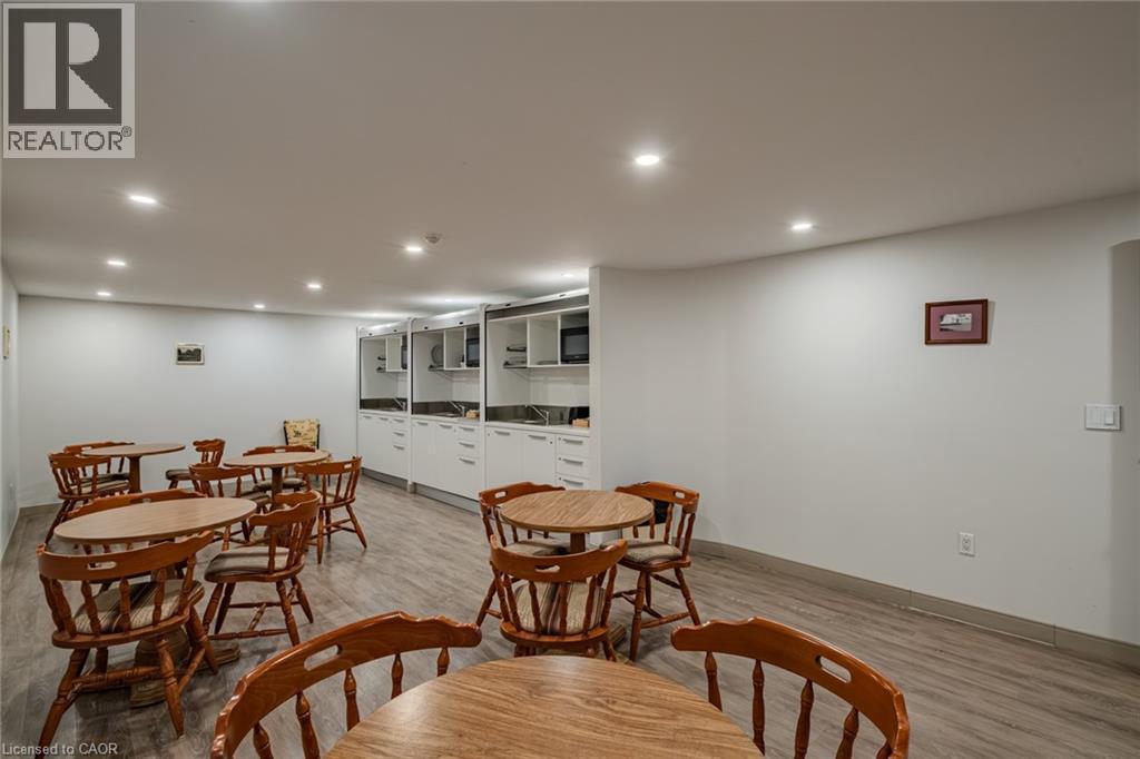Dining room with recessed lighting and light wood-style floors - 30 John Street, Port Dover, ON