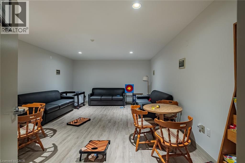 Living room featuring light wood-style floors and recessed lighting - 30 John Street, Port Dover, ON
