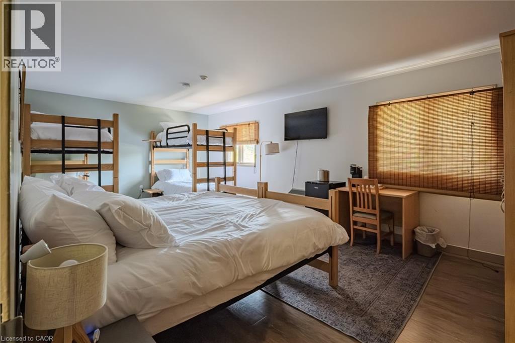 Bedroom featuring wood finished floors - 30 John Street, Port Dover, ON
