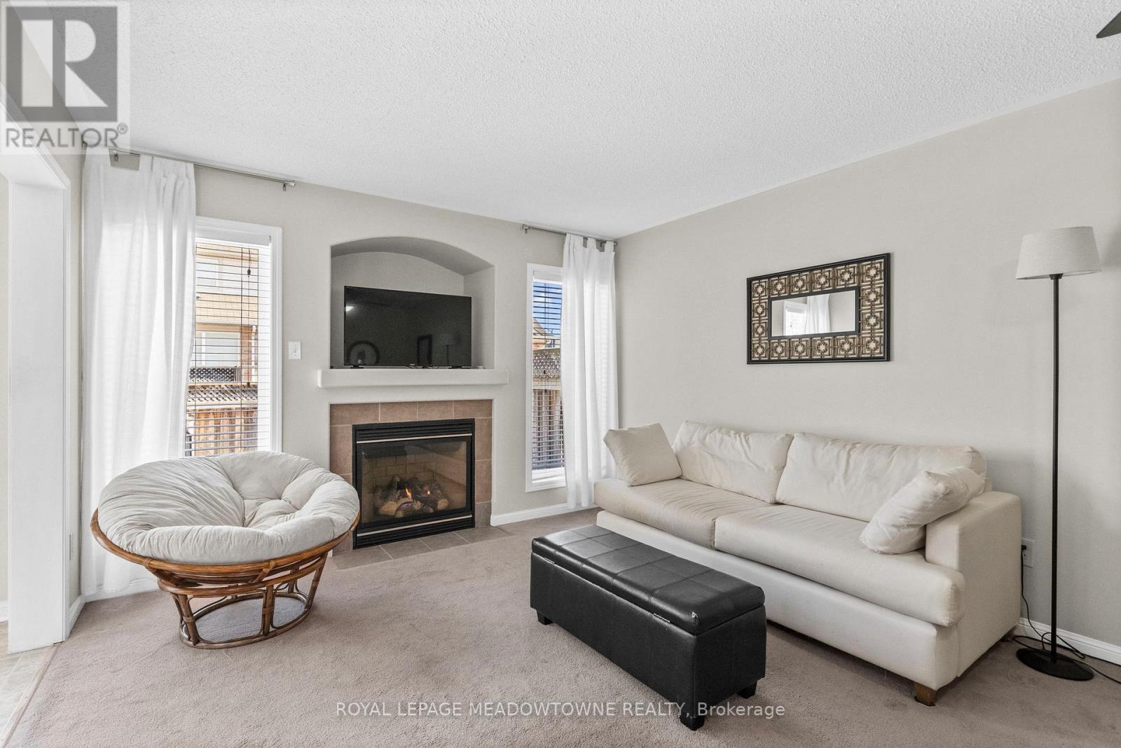 862 Stark Circle, Milton, ON - Indoor Photo Showing Living Room With Fireplace