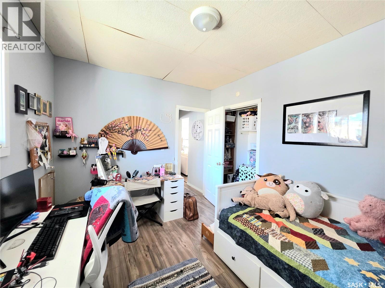 311 5Th Avenue E, Melville, SK - Indoor Photo Showing Bedroom