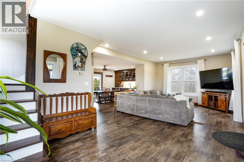 Living room with dark wood-type flooring, plenty of natural light, recessed lighting, and ceiling fan - 23247 Beattie Line, Elgin, ON - Indoor Photo Showing Living Room