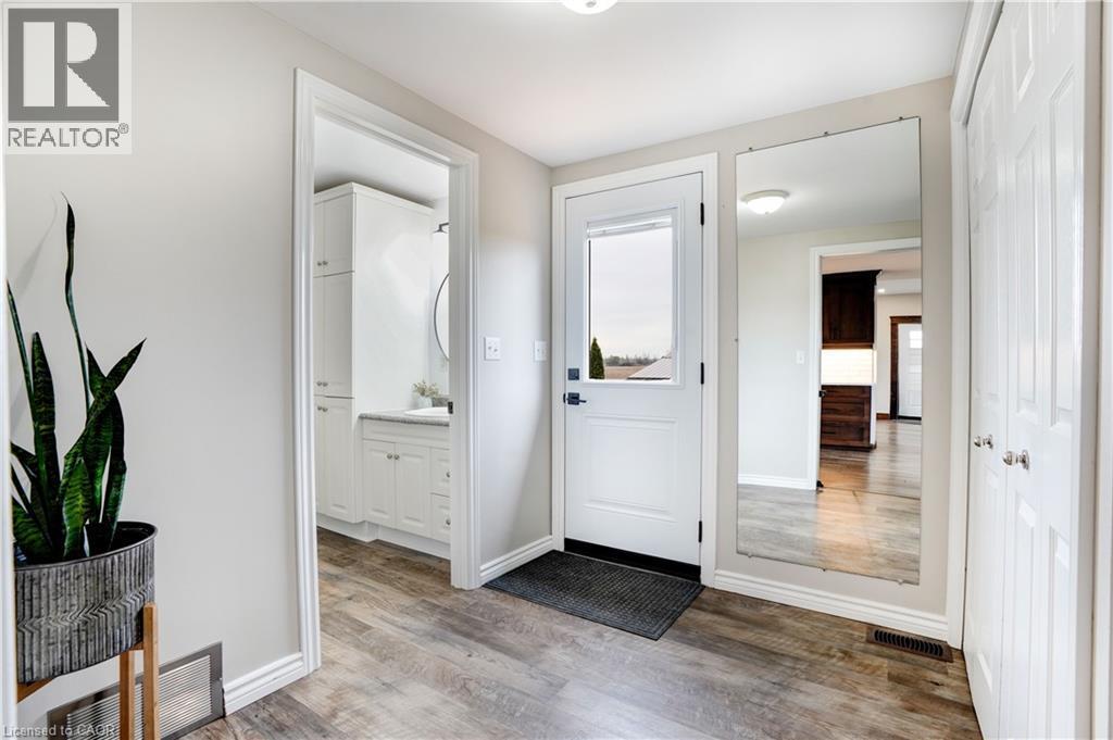 Foyer entrance featuring light wood-type flooring and baseboards - 23247 Beattie Line, Elgin, ON - Indoor Photo Showing Other Room