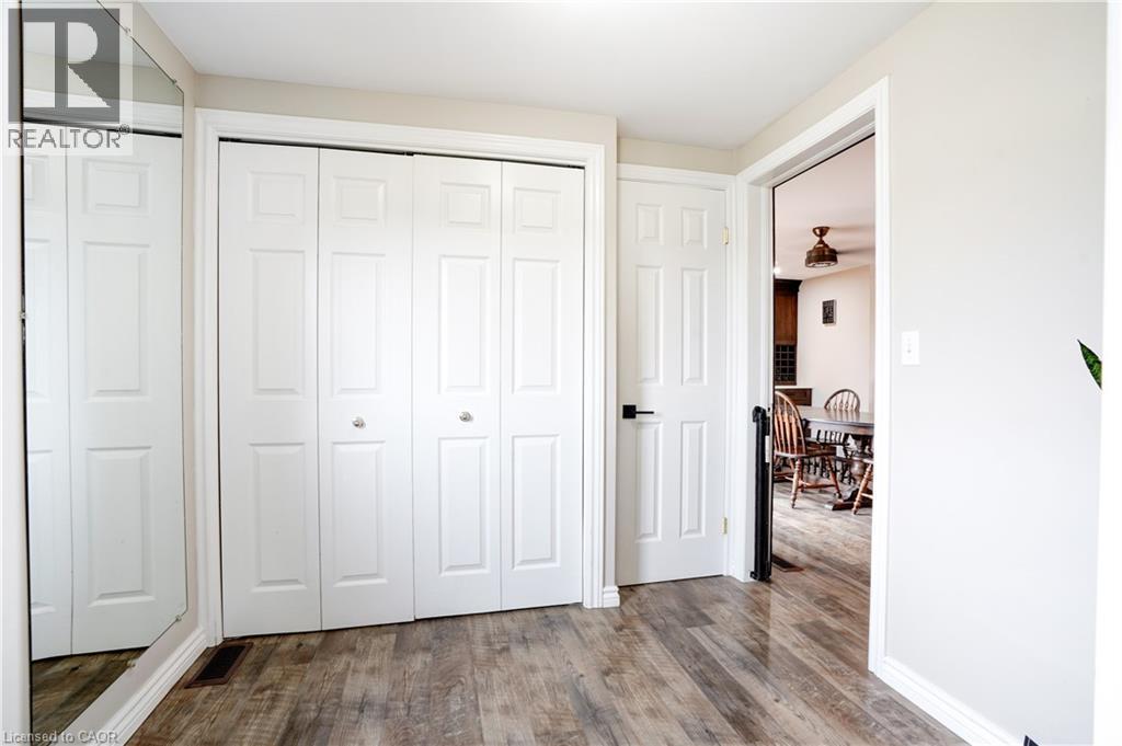 Bedroom featuring dark wood-style floors - 23247 Beattie Line, Elgin, ON - Indoor Photo Showing Other Room