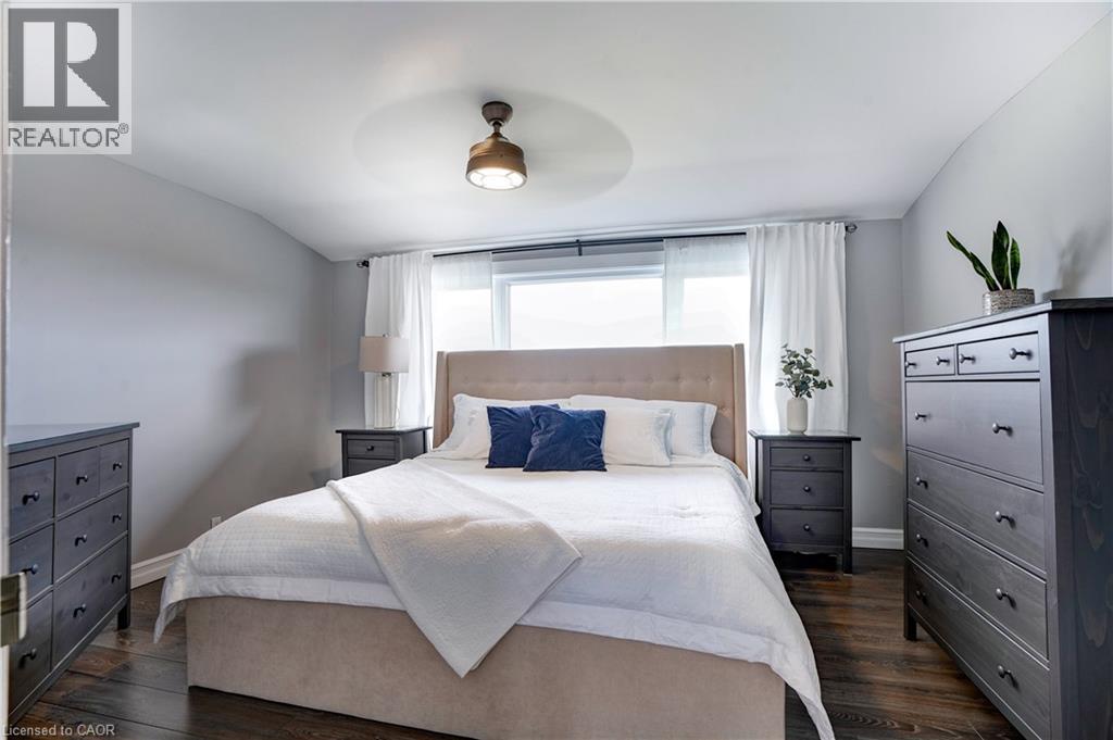 Bedroom featuring dark wood finished floors, lofted ceiling, and ceiling fan - 23247 Beattie Line, Elgin, ON - Indoor Photo Showing Bedroom