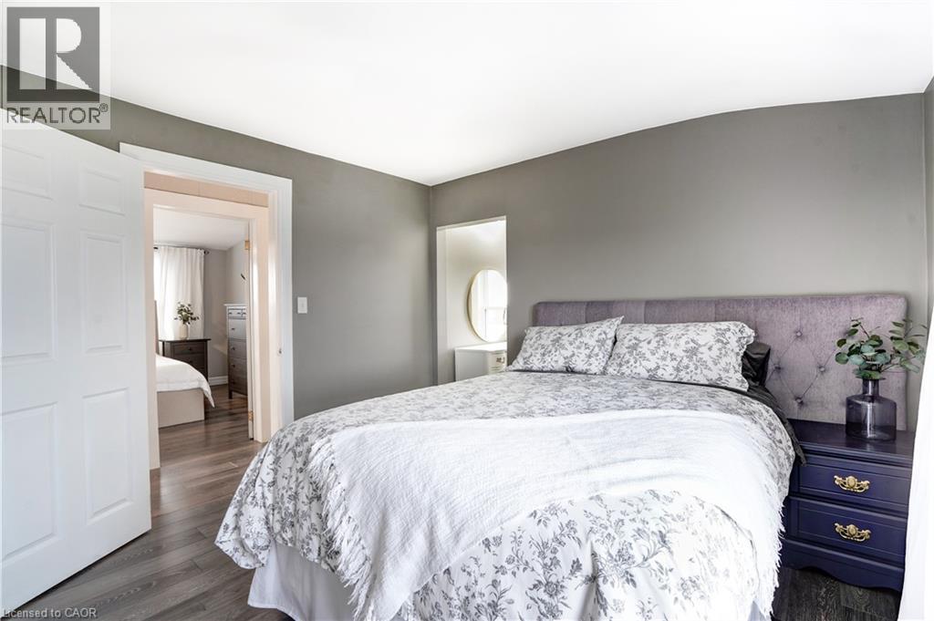 Bedroom with dark wood-type flooring - 23247 Beattie Line, Elgin, ON - Indoor Photo Showing Bedroom