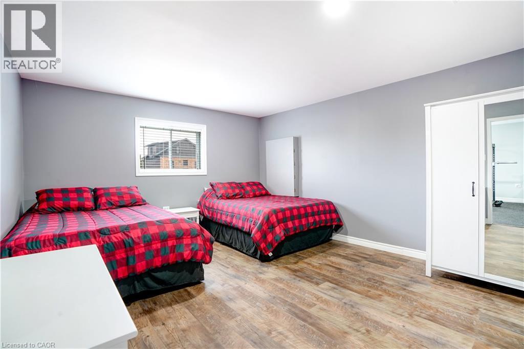 Bedroom with light wood-style flooring and baseboards - 23247 Beattie Line, Elgin, ON - Indoor Photo Showing Bedroom