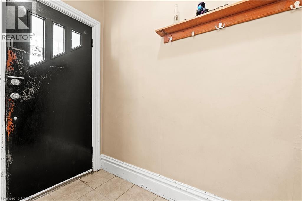 Doorway to outside featuring tile patterned floors - 78 Clyde Street, Hamilton, ON - Indoor Photo Showing Other Room