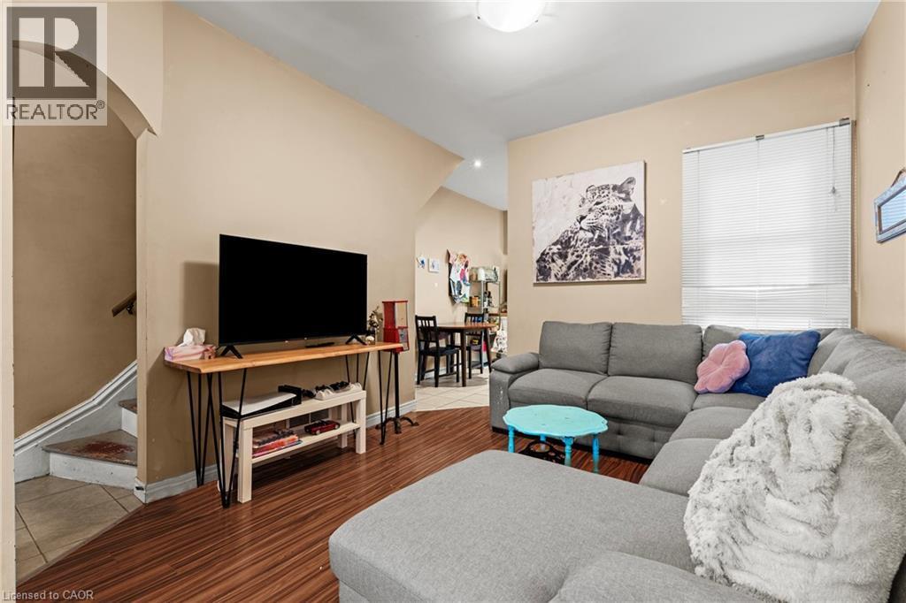 Living area with stairway and wood finished floors - 78 Clyde Street, Hamilton, ON - Indoor Photo Showing Living Room