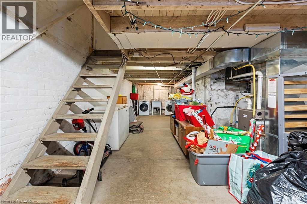 Unfinished below grade area with independent washer and dryer and a sink - 78 Clyde Street, Hamilton, ON - Indoor Photo Showing Basement