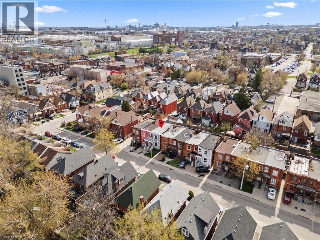 Residential streetscape featuring a mix of brick and painted stucco facades - 78 Clyde Street, Hamilton, ON - Outdoor With View
