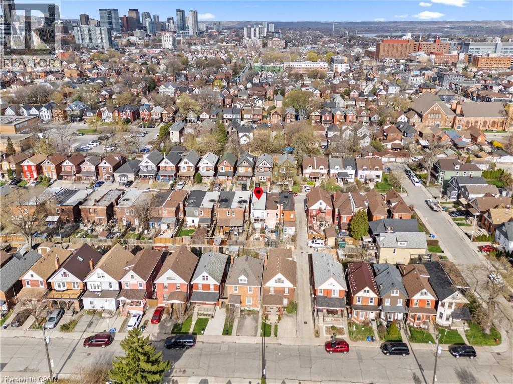 Aerial perspective of a detached property with a red roof, situated within a dense urban residential area - 78 Clyde Street, Hamilton, ON - Outdoor With View