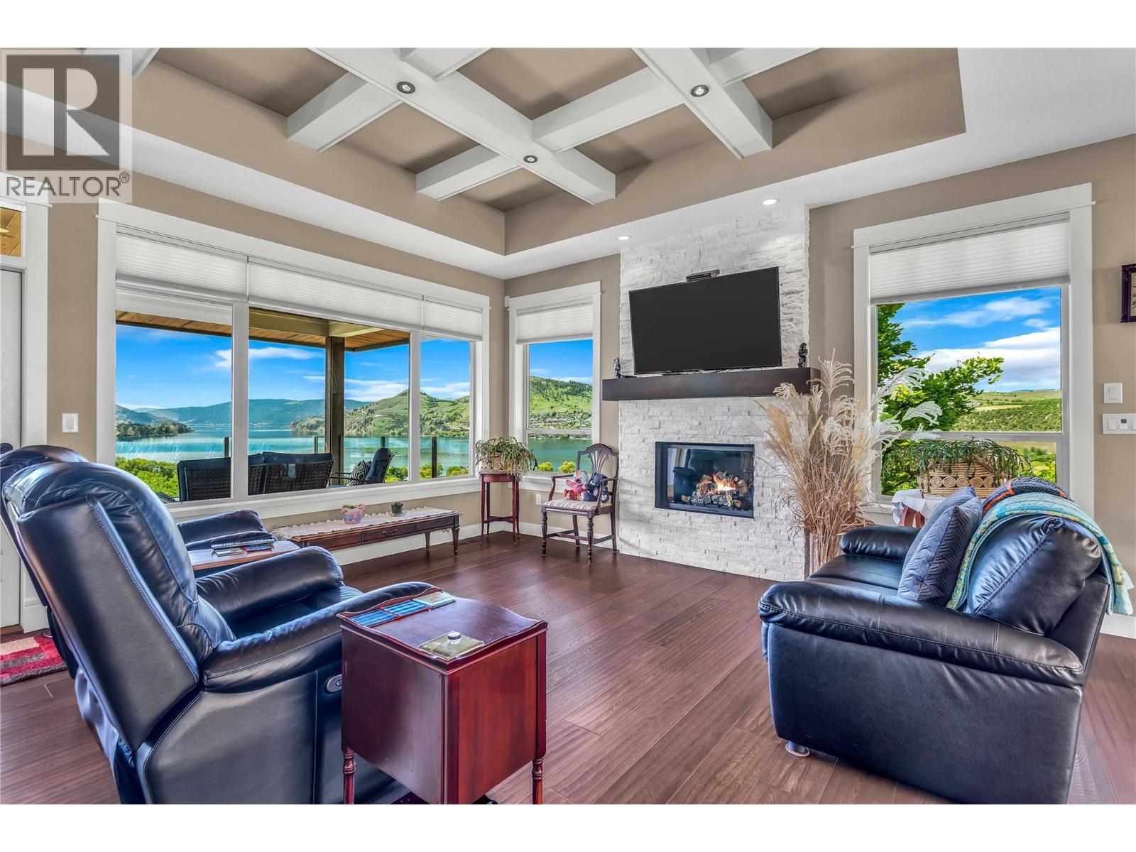 Gas Fireplace - 8780 Braeburn Drive, Coldstream, BC - Indoor Photo Showing Living Room With Fireplace