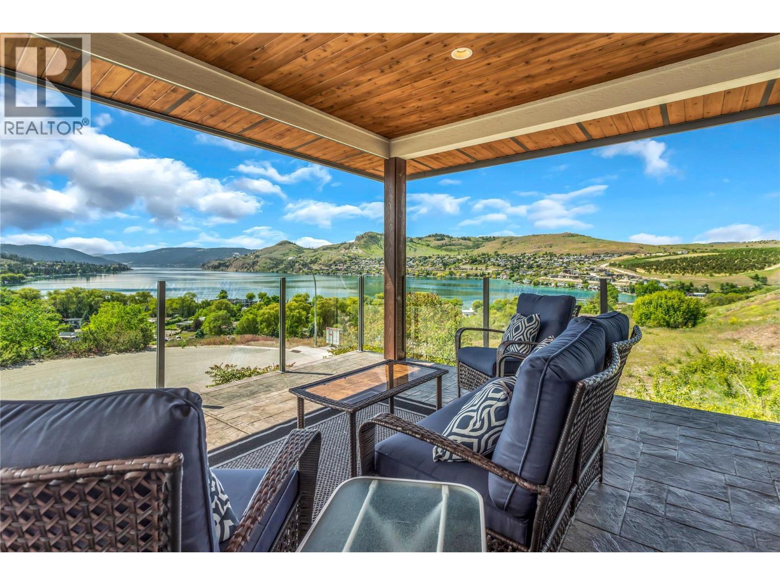 Deck View - 8780 Braeburn Drive, Coldstream, BC - Outdoor With Body Of Water With Deck Patio Veranda With View With Exterior