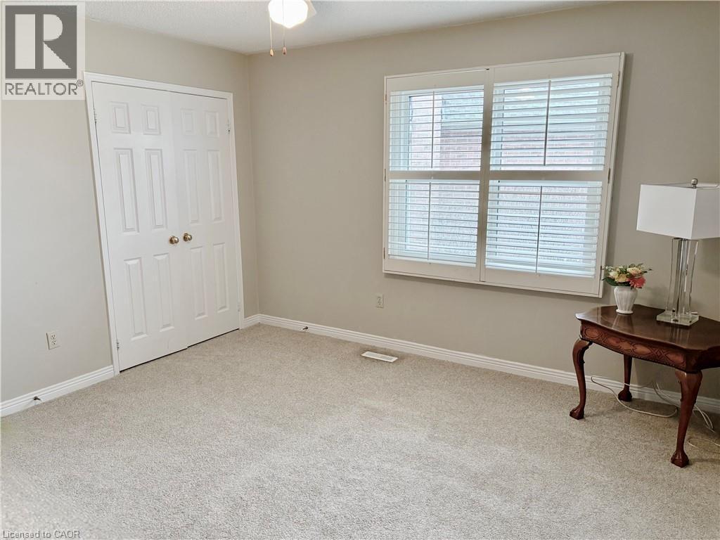 Bedroom with light colored carpet and a closet - 2056 Hadfield Court, Burlington, ON - Indoor Photo Showing Other Room