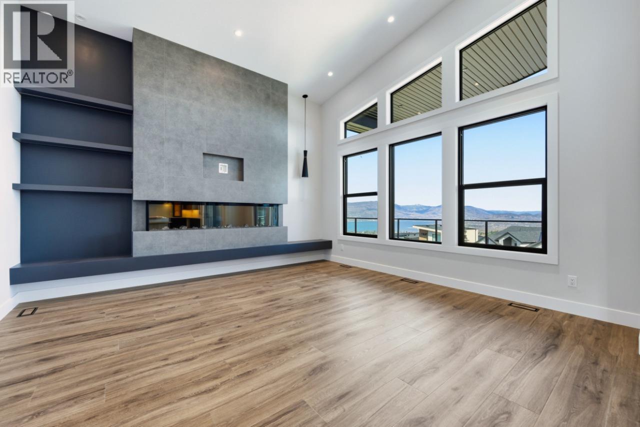 1120 Collinson Court, Kelowna, BC - Indoor Photo Showing Other Room With Fireplace