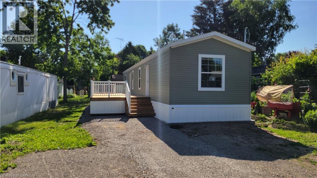 View of front of property featuring a wooden deck - 77 Park Lane, Flamborough, ON - Outdoor