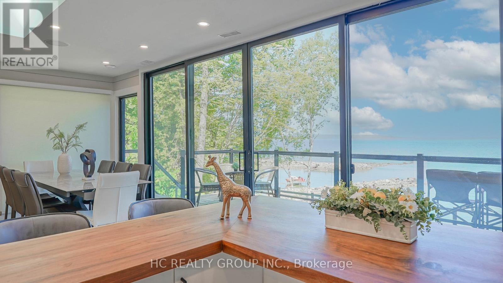 456 Silver Birch Drive, Tiny, ON - Indoor Photo Showing Dining Room With Body Of Water