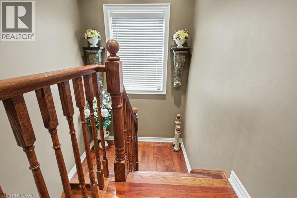 Staircase with wood finished floors and baseboards - 284 Normanhurst Avenue, Hamilton, ON - Indoor Photo Showing Other Room