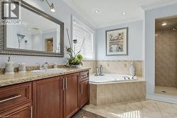 Full bathroom with vanity, a stall shower, light tile patterned floors, a garden tub, and recessed lighting -