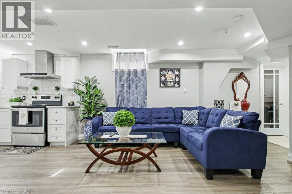 Living area featuring light wood-style floors and recessed lighting - 284 Normanhurst Avenue, Hamilton, ON - Indoor Photo Showing Living Room