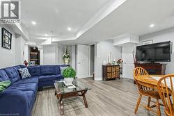Living area featuring light wood-style floors and recessed lighting -