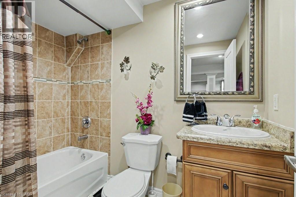 Full bath with vanity and shower / tub combo with curtain - 284 Normanhurst Avenue, Hamilton, ON - Indoor Photo Showing Bathroom