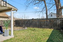 Fenced backyard with a patio -