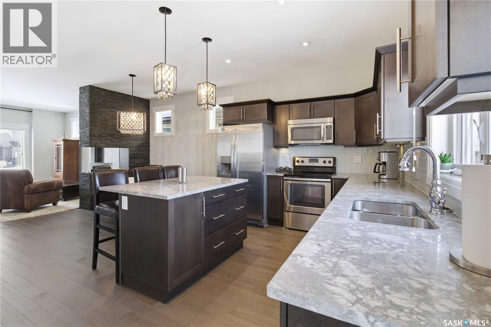 23 111 Rosewood Gate N, Saskatoon, SK - Indoor Photo Showing Kitchen With Stainless Steel Kitchen With Double Sink With Upgraded Kitchen