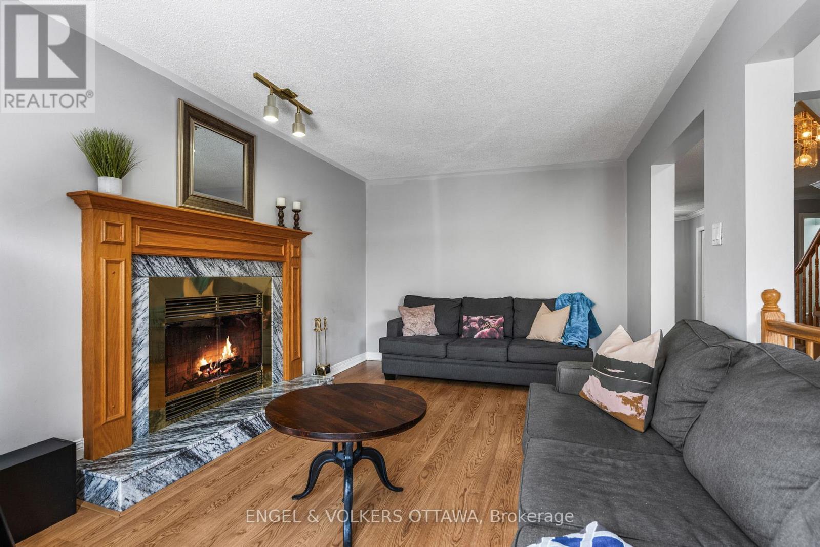 17 Hunterswood Crescent, Ottawa, ON - Indoor Photo Showing Living Room With Fireplace