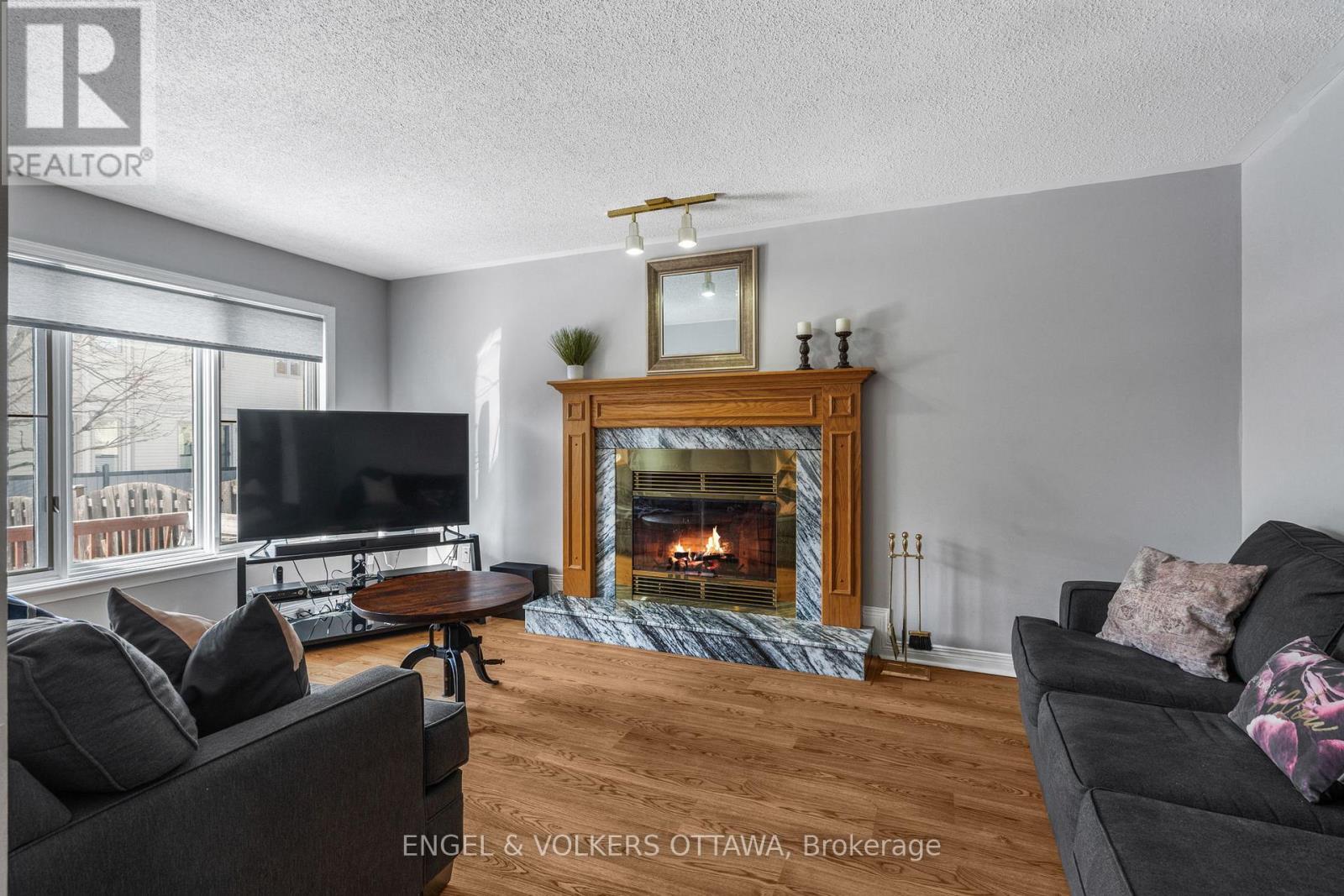 17 Hunterswood Crescent, Ottawa, ON - Indoor Photo Showing Living Room With Fireplace